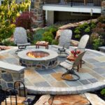 Round Slate Patio with stone firepit and stone walls MILLER - artisan masonry
