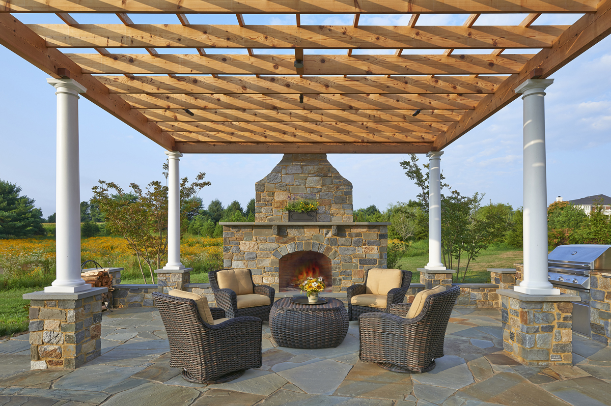 Patio with stone fireplace - DiSabatino Landscaping